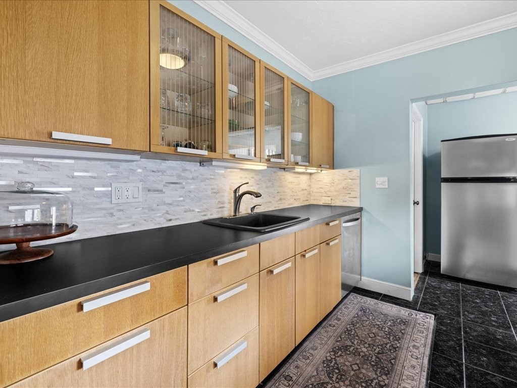 37 Summer Street Dighton, MA 02764 - Photo 24 of 34 a kitchen with stainless steel appliances granite countertop a sink stove and refrigerator