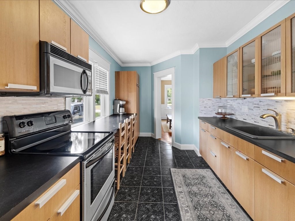 37 Summer Street Dighton, MA 02764 - Photo 25 of 34 a kitchen with stainless steel appliances a stove sink and cabinets