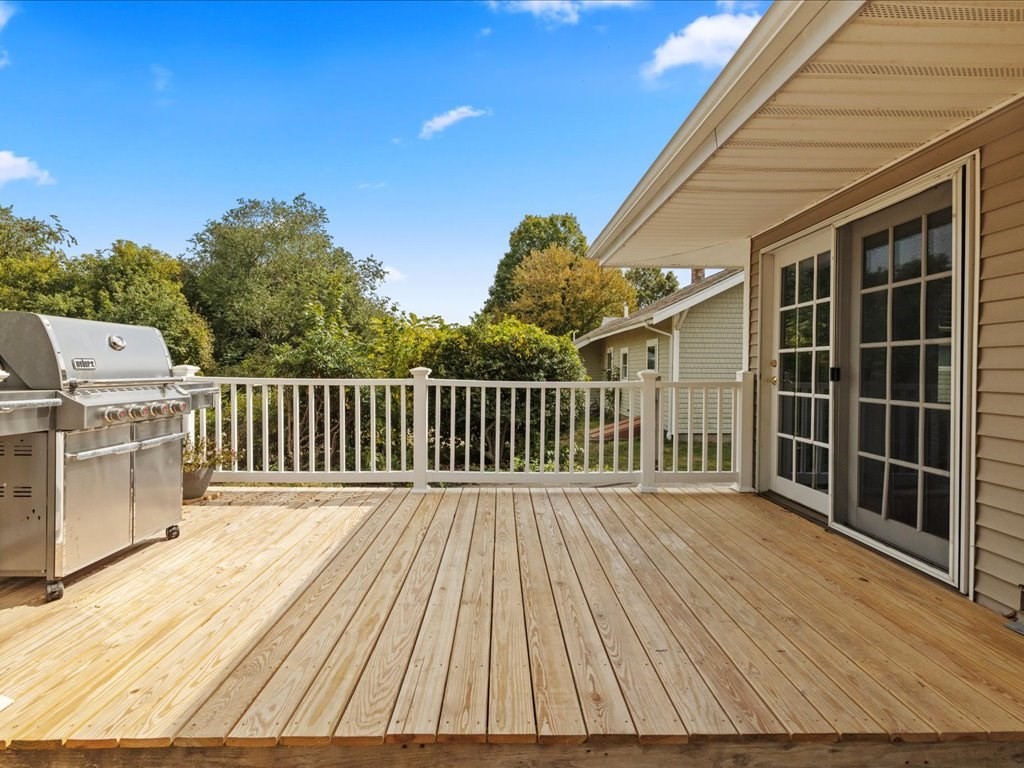 37 Summer Street Dighton, MA 02764 - Photo 29 of 34 a balcony with a floor to ceiling window with wooden floor