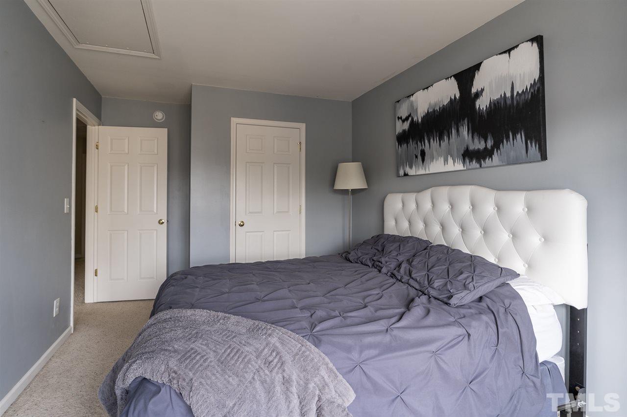 3111 Winding Waters Way Raleigh, NC 27614 - Photo 14 of 24 a bedroom with a bed and painting on the wall