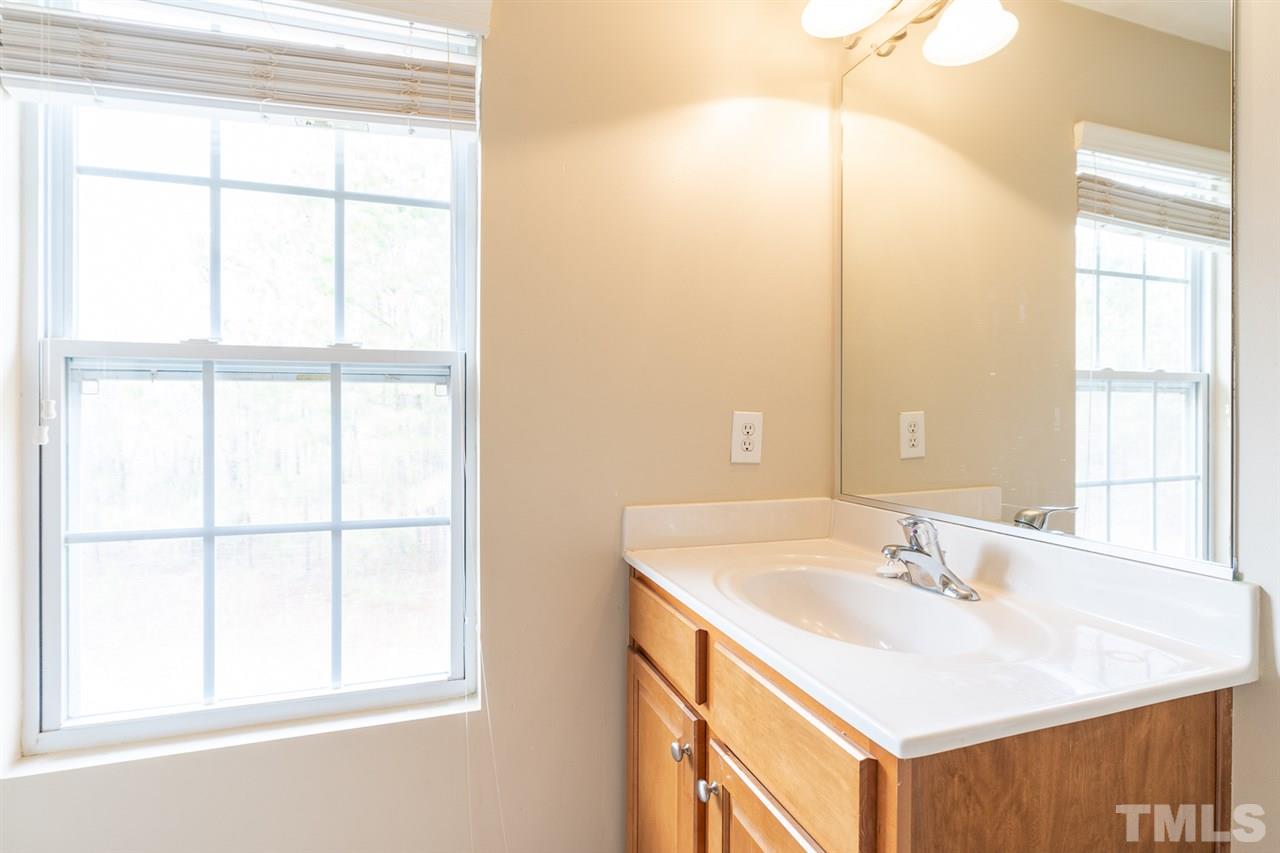 3111 Winding Waters Way Raleigh, NC 27614 - Photo 19 of 24 a bathroom with a sink and a bathtub