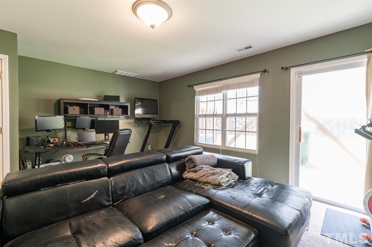 3111 Winding Waters Way Raleigh, NC 27614 - Photo 22 of 24 a living room with furniture and a window
