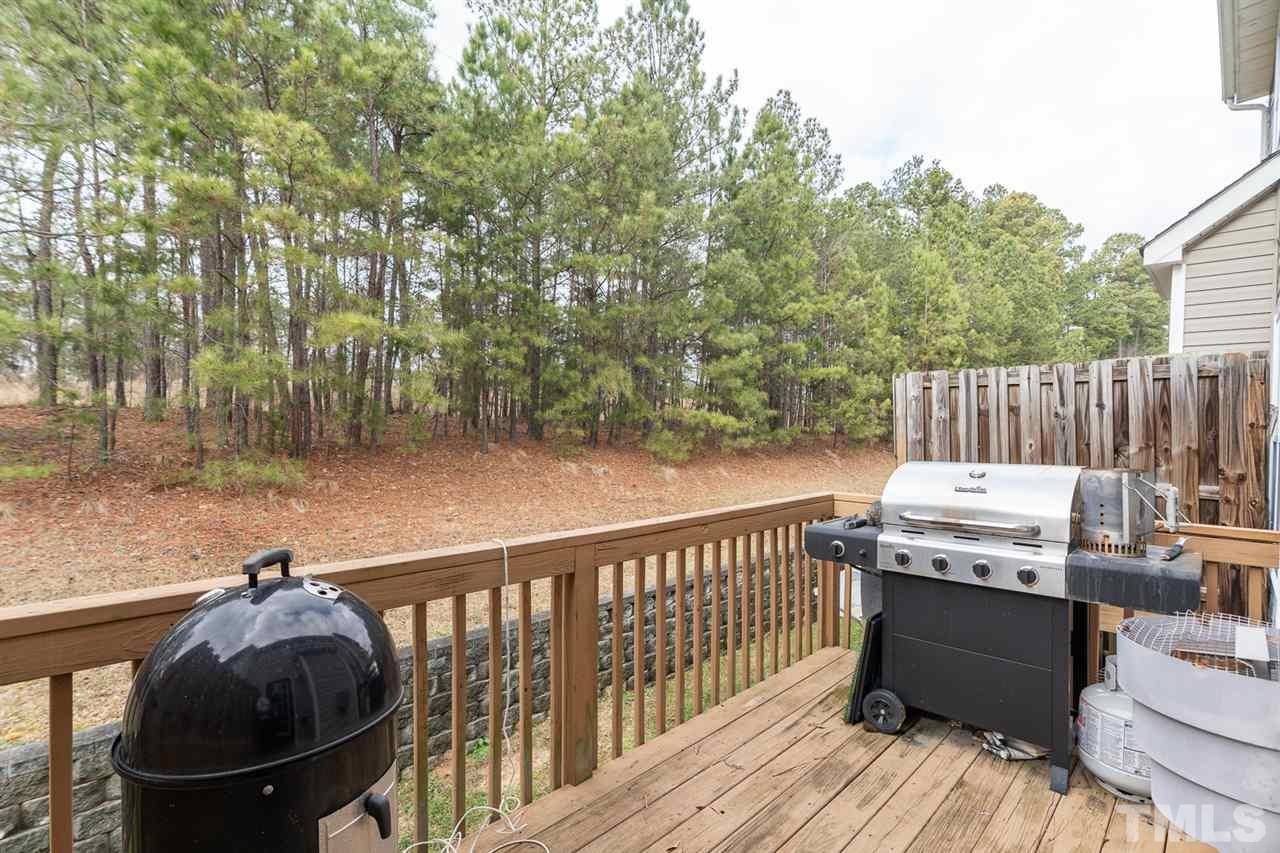 3111 Winding Waters Way Raleigh, NC 27614 - Photo 23 of 24 a view of a deck with a yard
