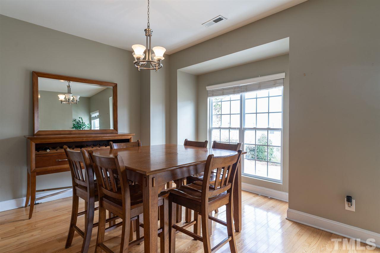 3111 Winding Waters Way Raleigh, NC 27614 - Photo 9 of 24 a view of a dining room with furniture and window