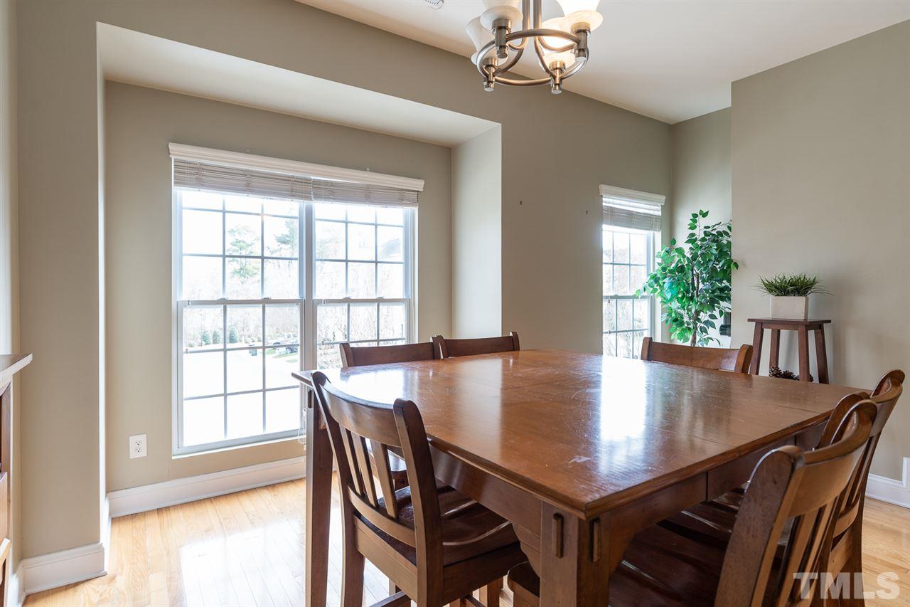 3111 Winding Waters Way Raleigh, NC 27614 - Photo 10 of 24 a view of a dining room with furniture window and wooden floor