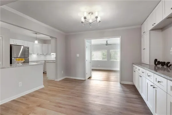 a view of a kitchen cabinets and wooden floor
