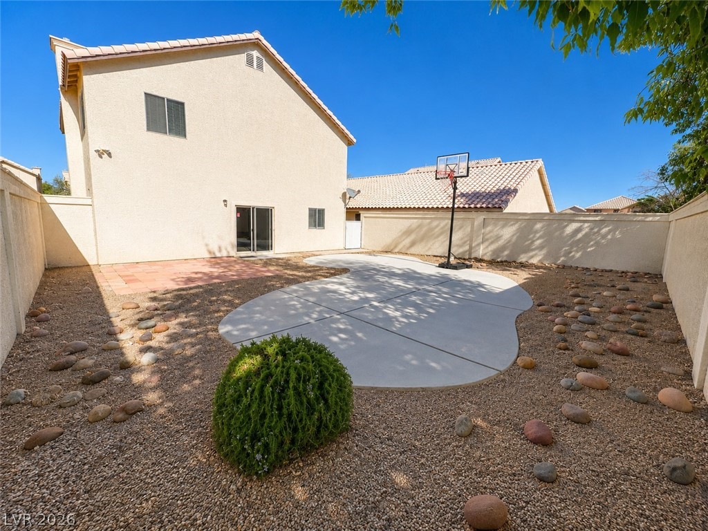 7213 London Bridge Avenue Las Vegas, NV 89130 - Photo 11 of 11 This outdoor space features a paved patio, gravel landscaping, and a fenced yard perfect for recreation.