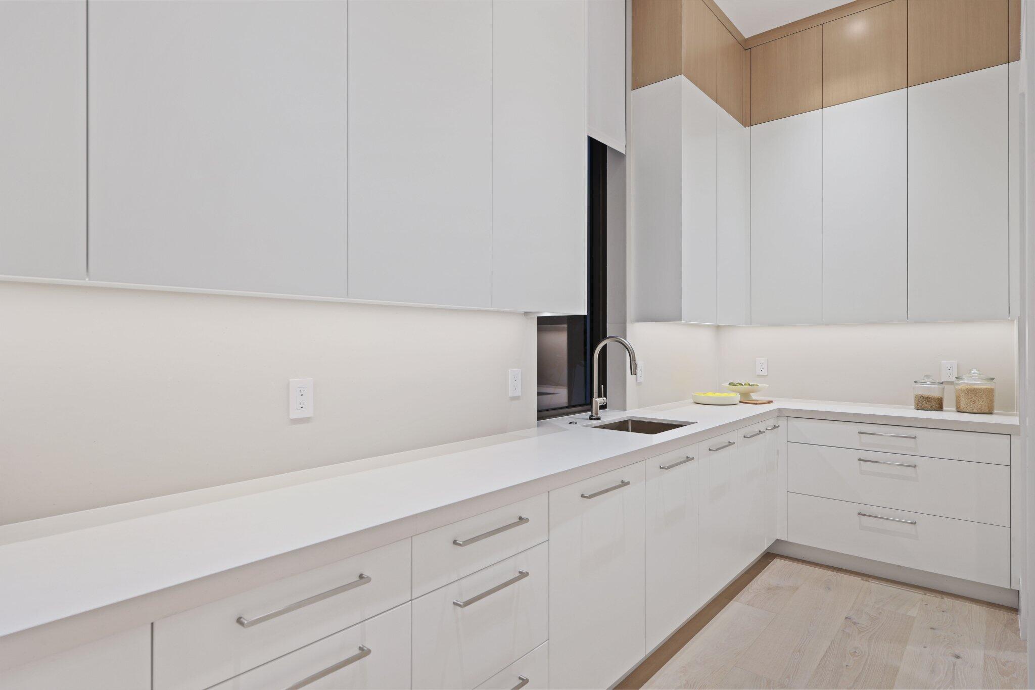 340 Grove Place Delray Beach, FL 33444 - Photo 20 of 89 a kitchen with a sink and cabinets