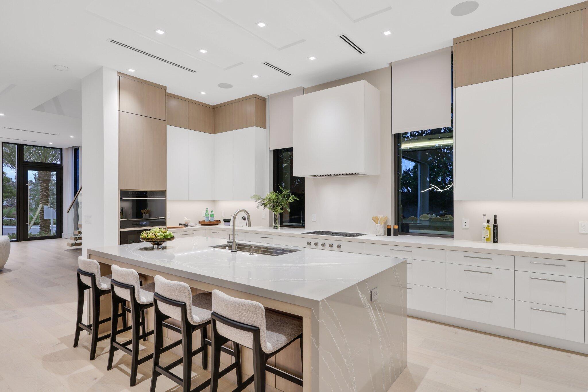 340 Grove Place Delray Beach, FL 33444 - Photo 21 of 89 a kitchen with appliances a sink and cabinets