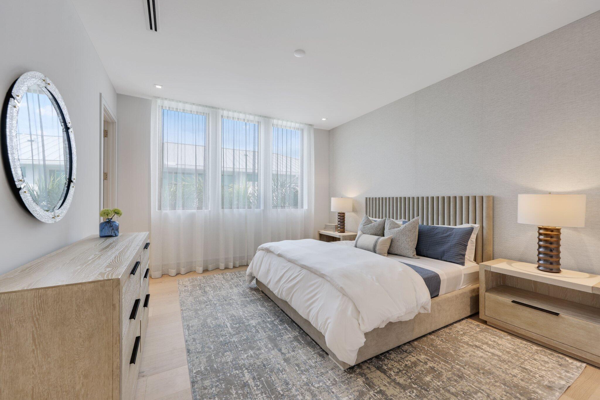 340 Grove Place Delray Beach, FL 33444 - Photo 61 of 89 a bedroom with a bed a mirror and a window