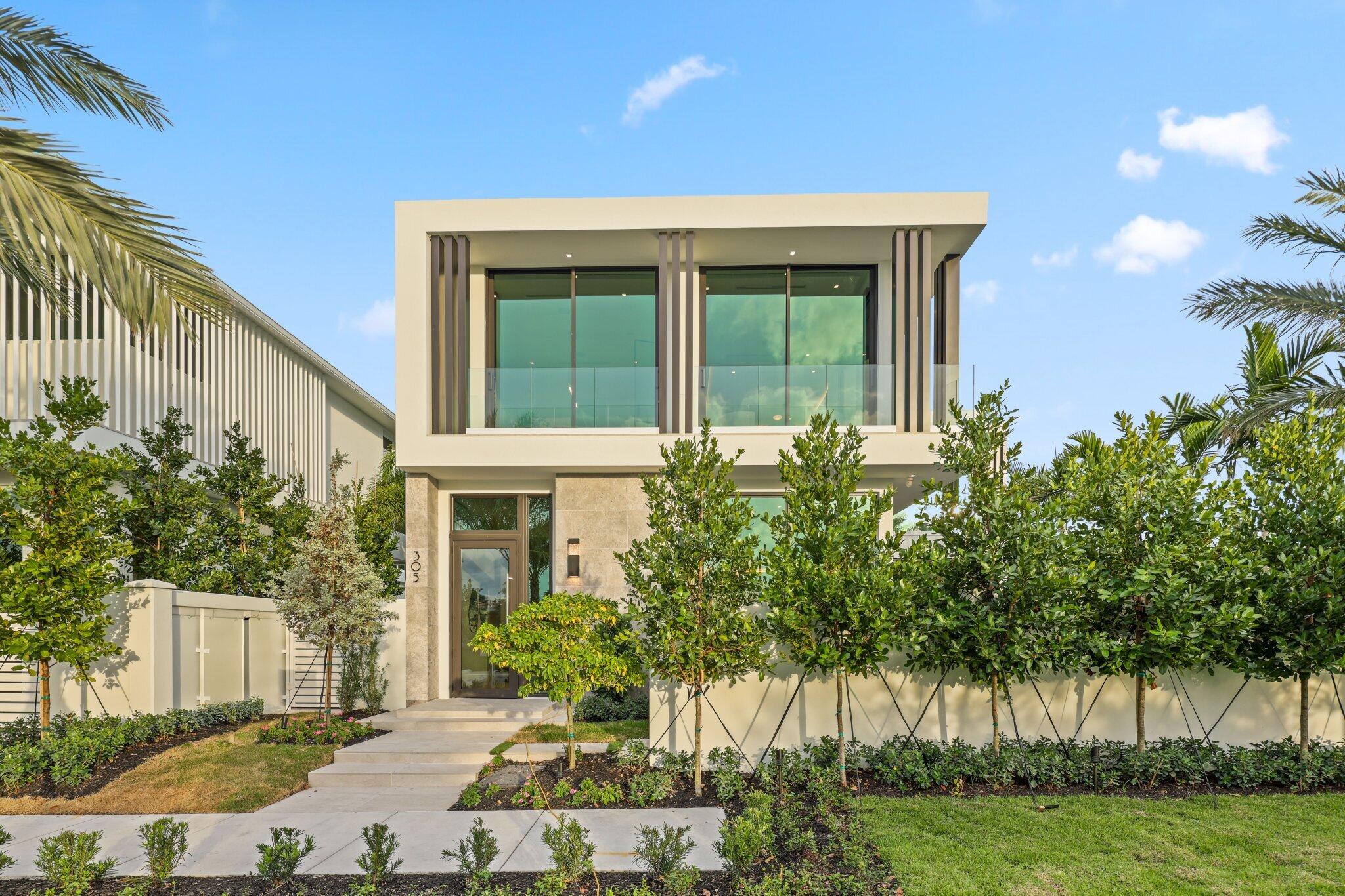 340 Grove Place Delray Beach, FL 33444 - Photo 8 of 89 a front view of a house with a yard