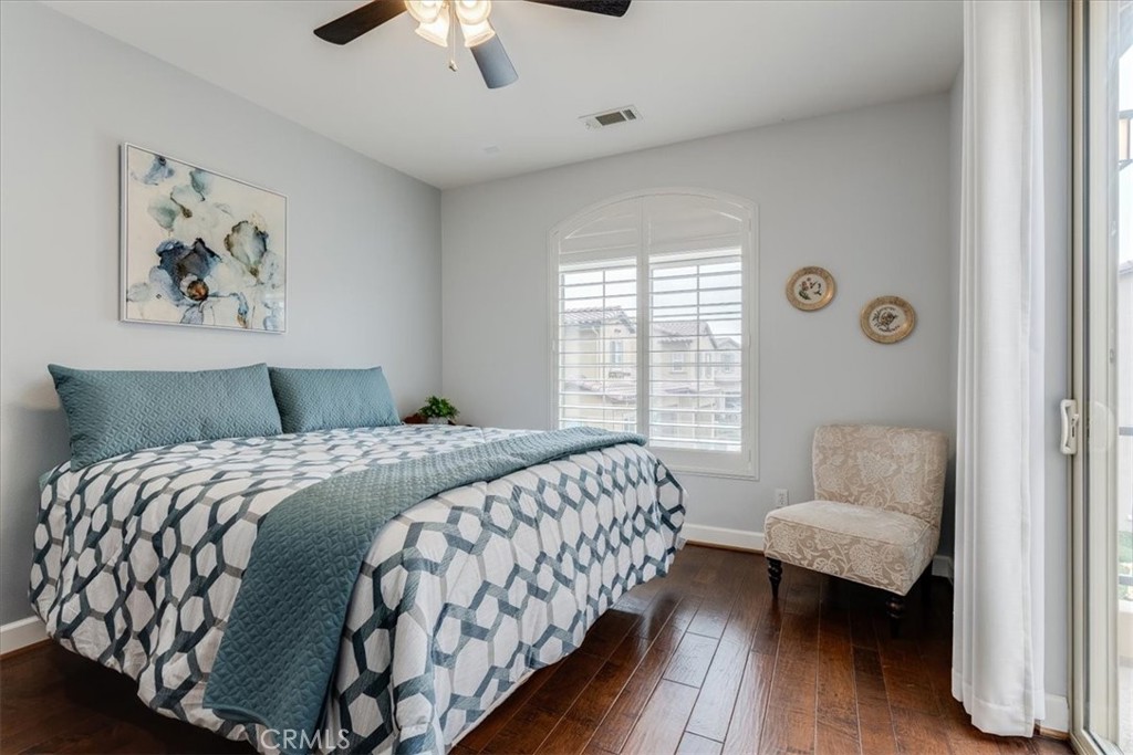 1197 Swallowtail Way, Unit 61 Nipomo, CA 93444 - Photo 24 of 36 Primary Bedroom, Wood Floors, Windows with a West-Facing View.