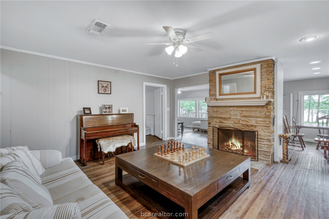 11452 Riley Green Road Franklin, TX 77856 - Photo 6 of 31 a living room with furniture and a fireplace