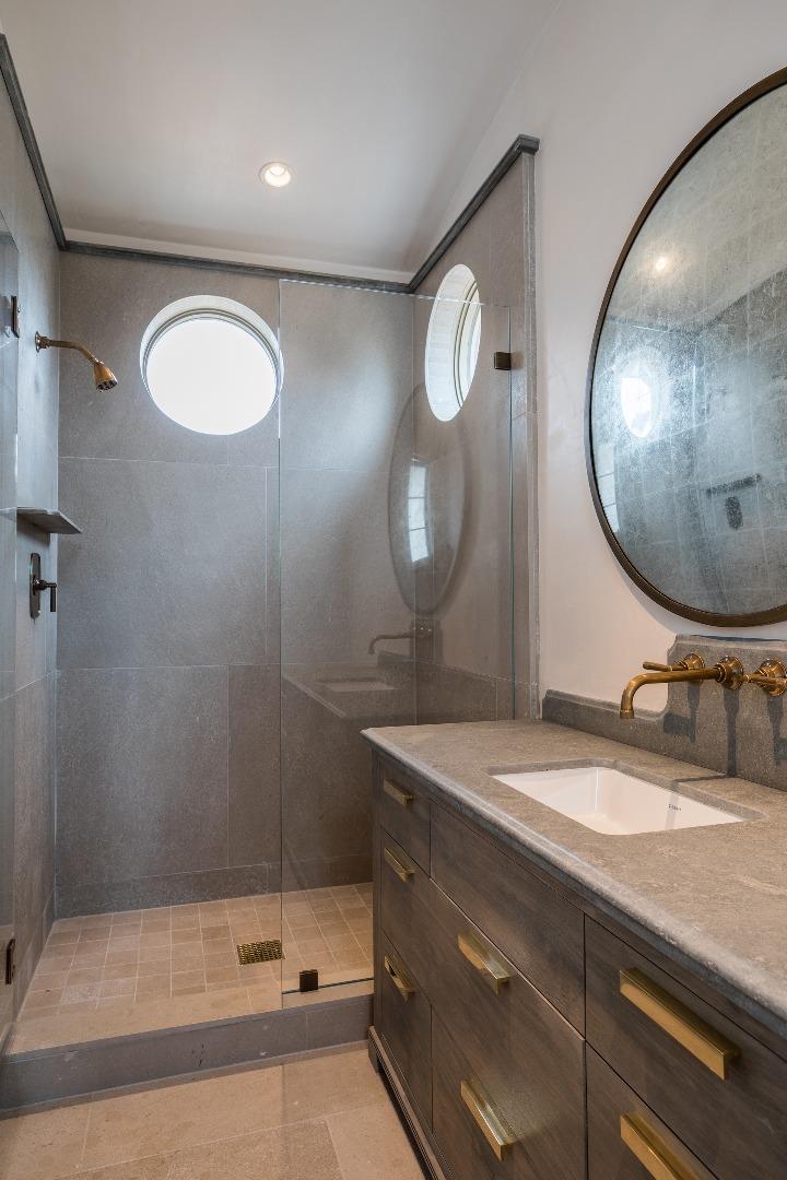 3028 Valdez Road Pebble Beach, CA 93953 - Photo 17 of 27 a bathroom with a sink and a mirror