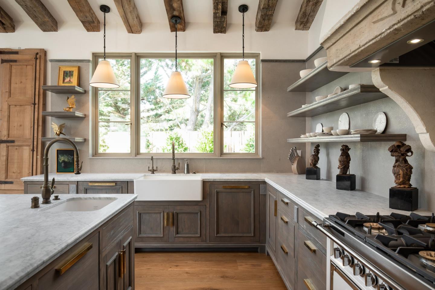 3028 Valdez Road Pebble Beach, CA 93953 - Photo 8 of 27 a kitchen with a sink stove and cabinets