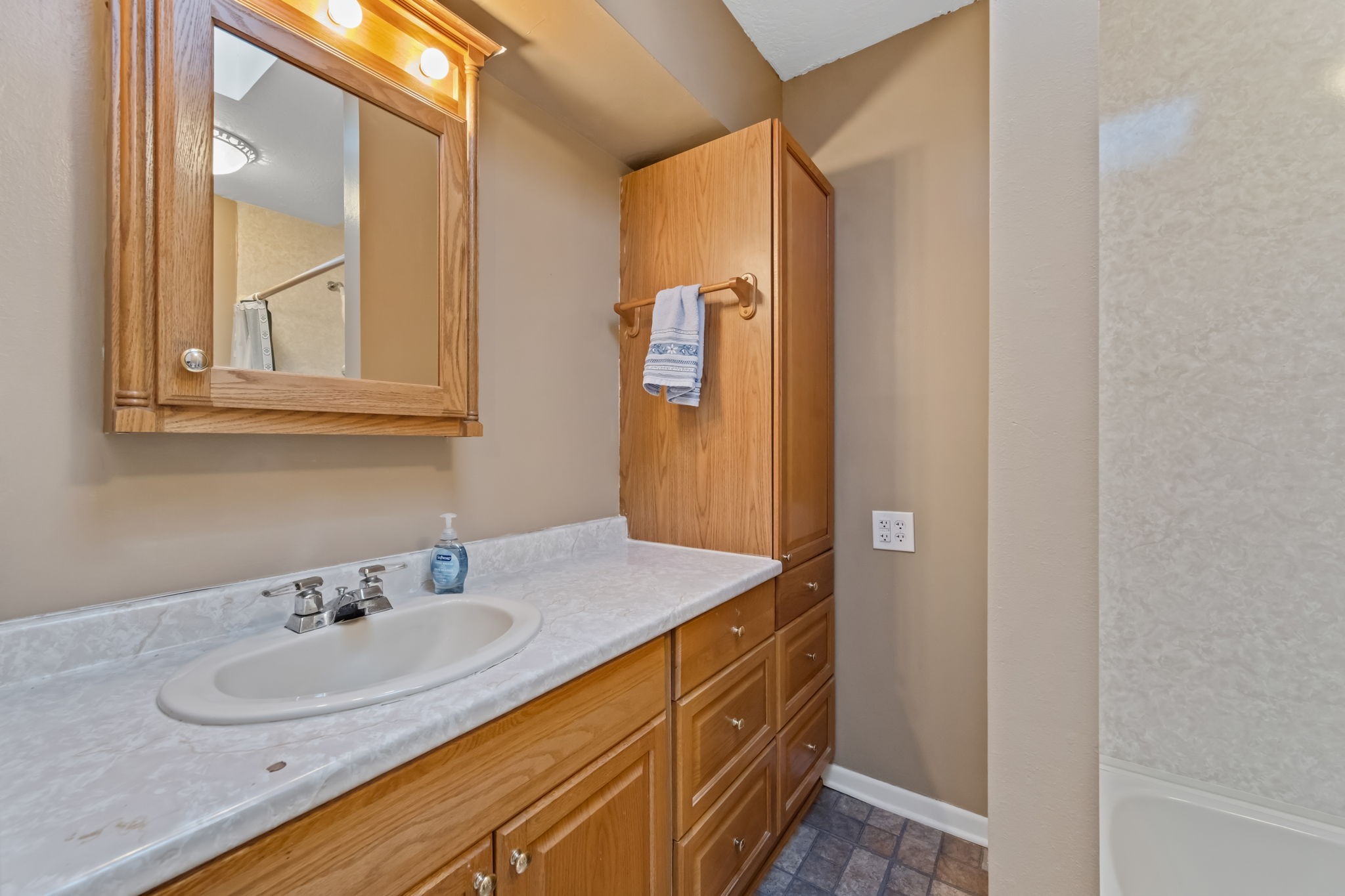 1609 Bowie Street Liberty, TX 77575 - Photo 17 of 24 a bathroom with a sink and a mirror