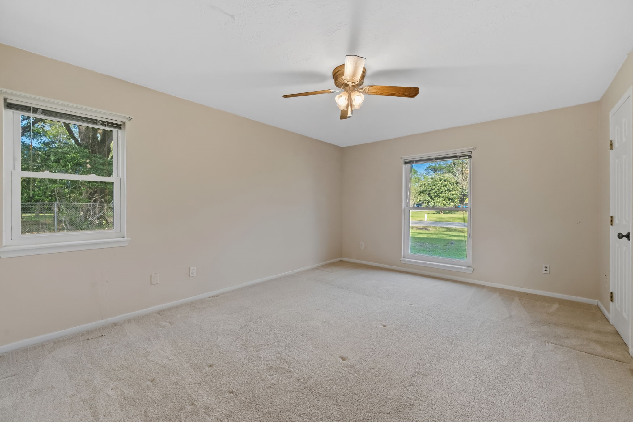 1609 Bowie Street Liberty, TX 77575 - Photo 18 of 24 a view of an empty room with a window