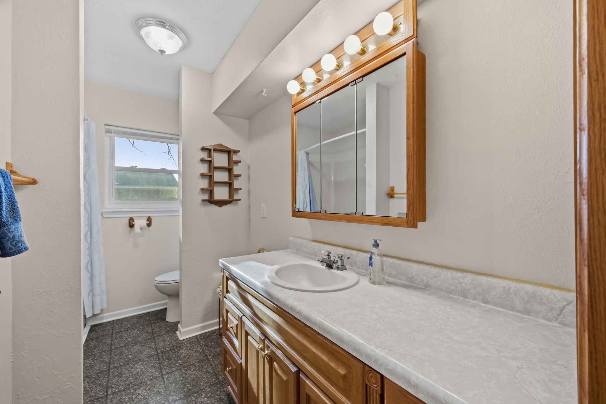 1609 Bowie Street Liberty, TX 77575 - Photo 20 of 24 a bathroom with a sink a toilet and shower