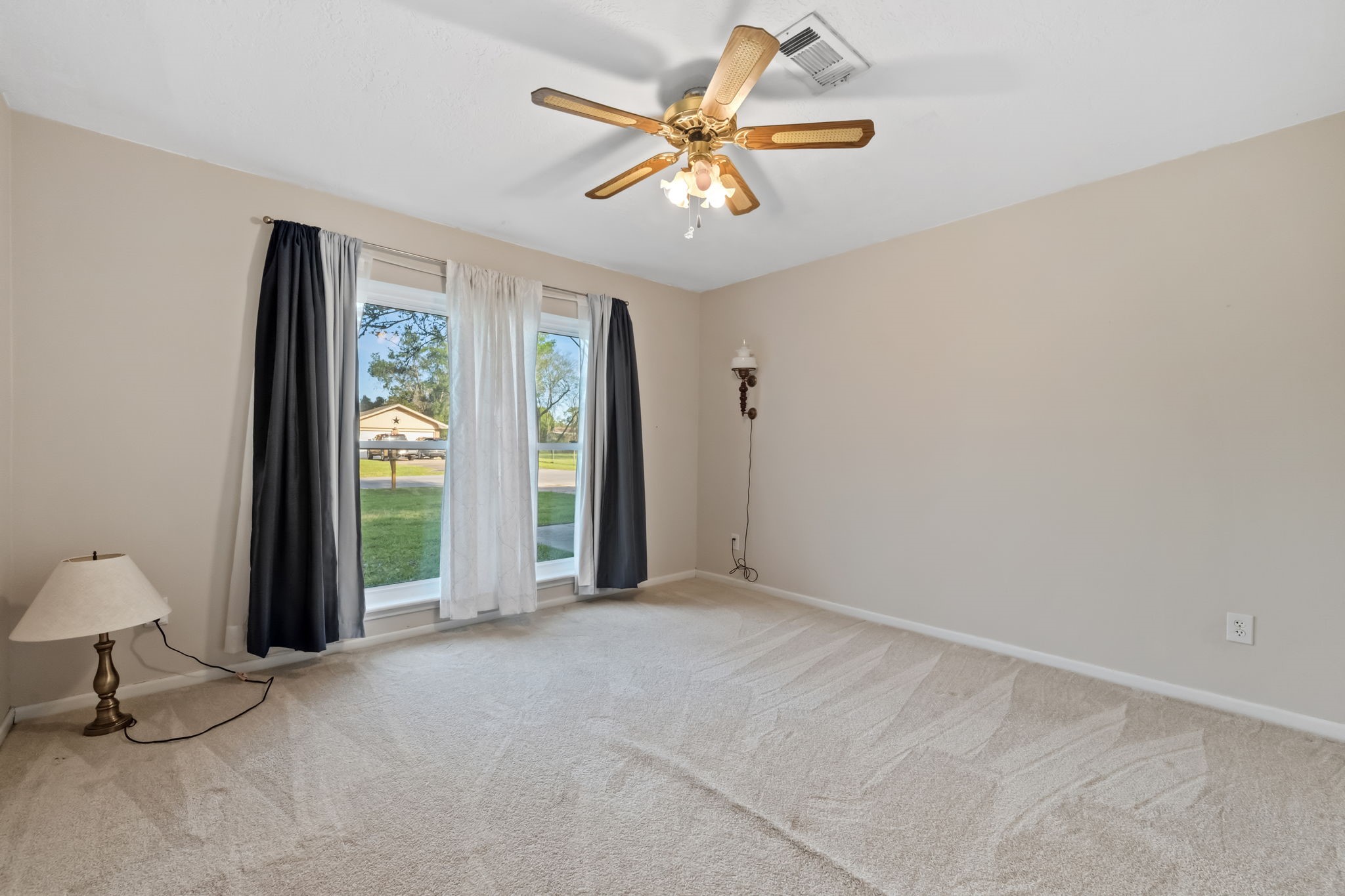 1609 Bowie Street Liberty, TX 77575 - Photo 21 of 24 a view of an empty room with a window
