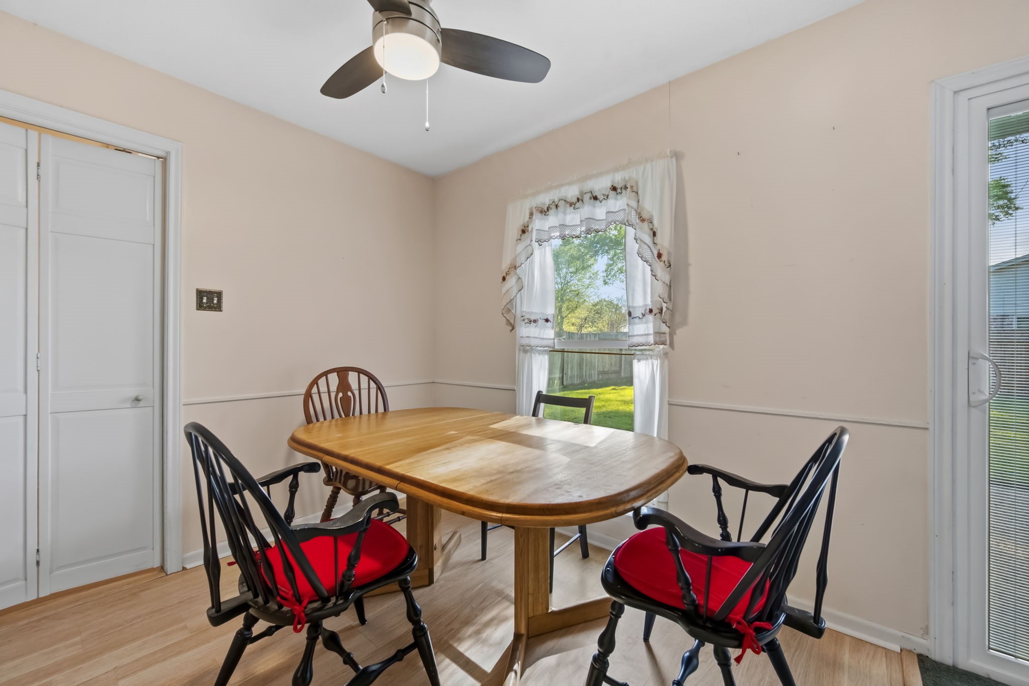1609 Bowie Street Liberty, TX 77575 - Photo 9 of 24 a view of a dining room with furniture and a window