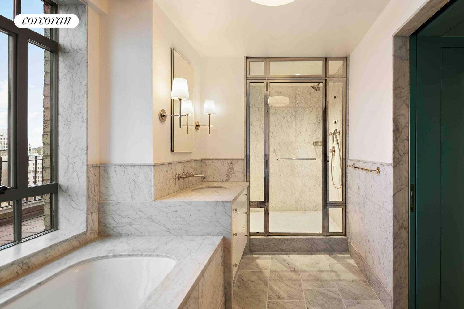 140 Riverside Drive, Unit 19HO Manhattan, NY 10024 - Photo 29 of 35 a bathroom with a bathtub and a shower