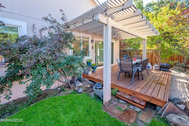 a view of outdoor sitting area with furniture and garden