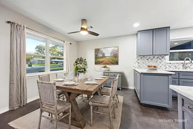 a view of a dining room with furniture and window