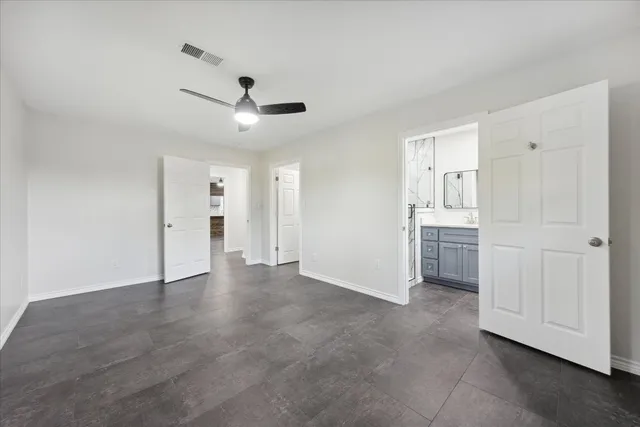 a view of an empty room and closet area