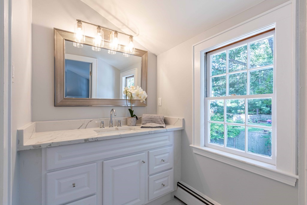 49 Pilgrim Road Wellesley, MA 02481 - Photo 17 of 25 a bathroom with a sink and a mirror