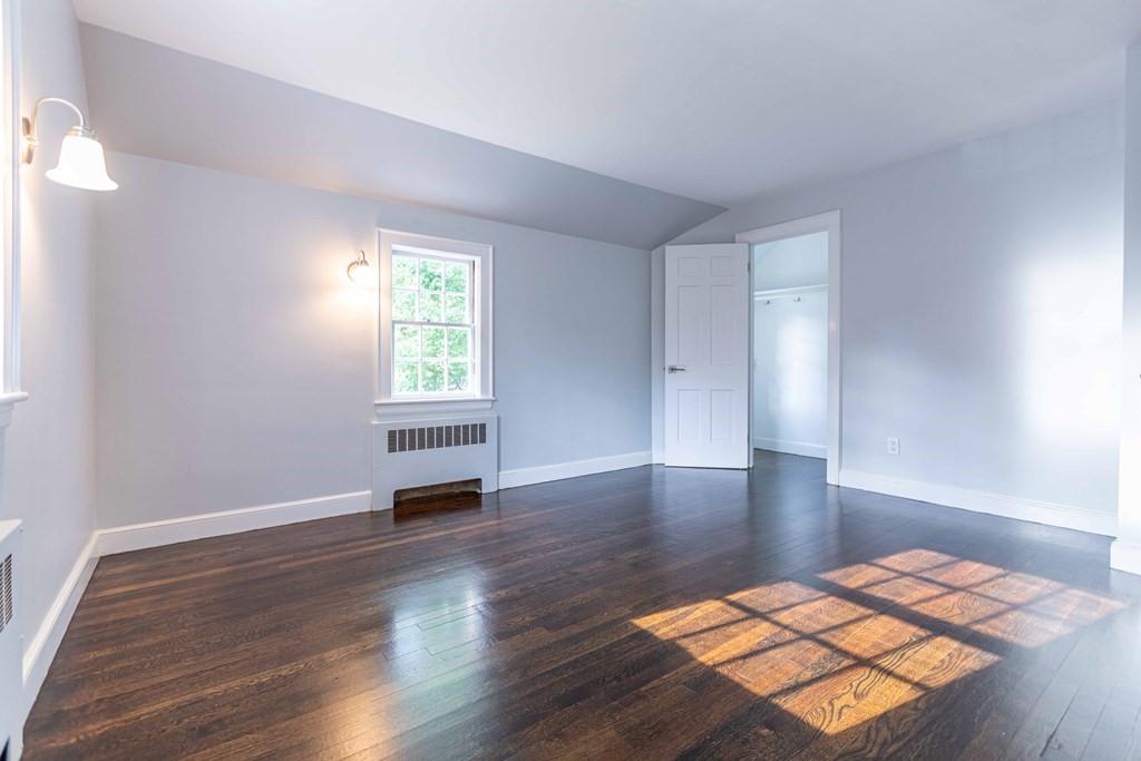 49 Pilgrim Road Wellesley, MA 02481 - Photo 19 of 25 a view of a room with wooden floor and windows