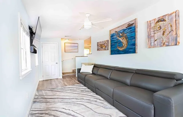 a spacious bedroom with a bed and a couch