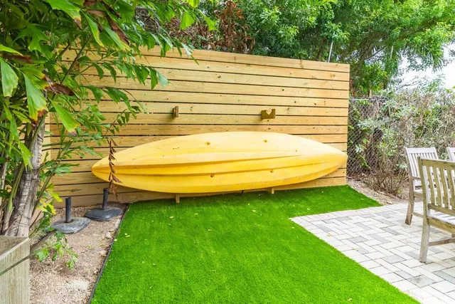 a view of a backyard with sitting area