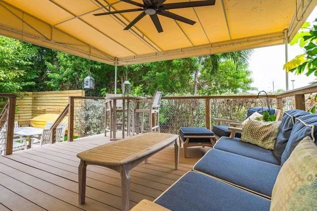 a view of a balcony with a potted plant on the wall