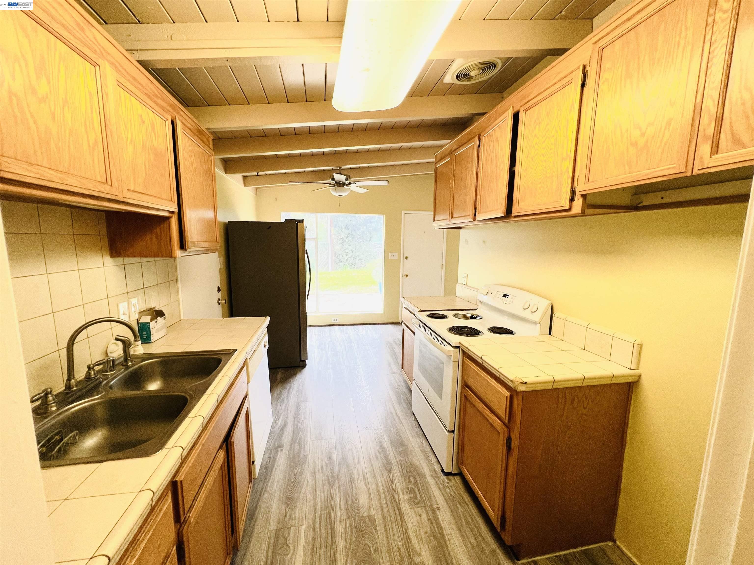 739 M Street Davis, CA 95616 - Photo 7 of 14 a kitchen that has a sink and a stove