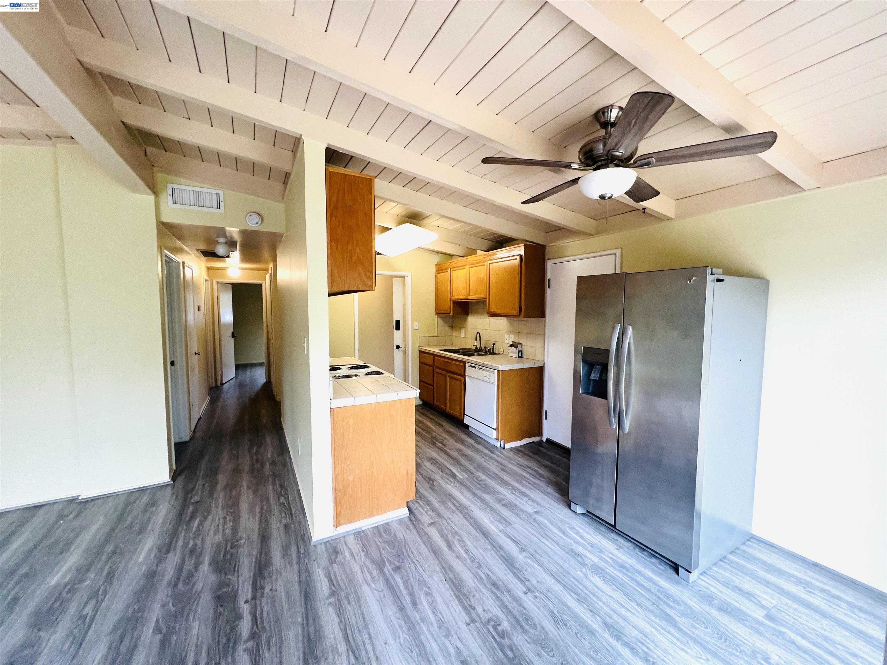 739 M Street Davis, CA 95616 - Photo 9 of 14 a view of a kitchen with stainless steel appliances wooden floor
