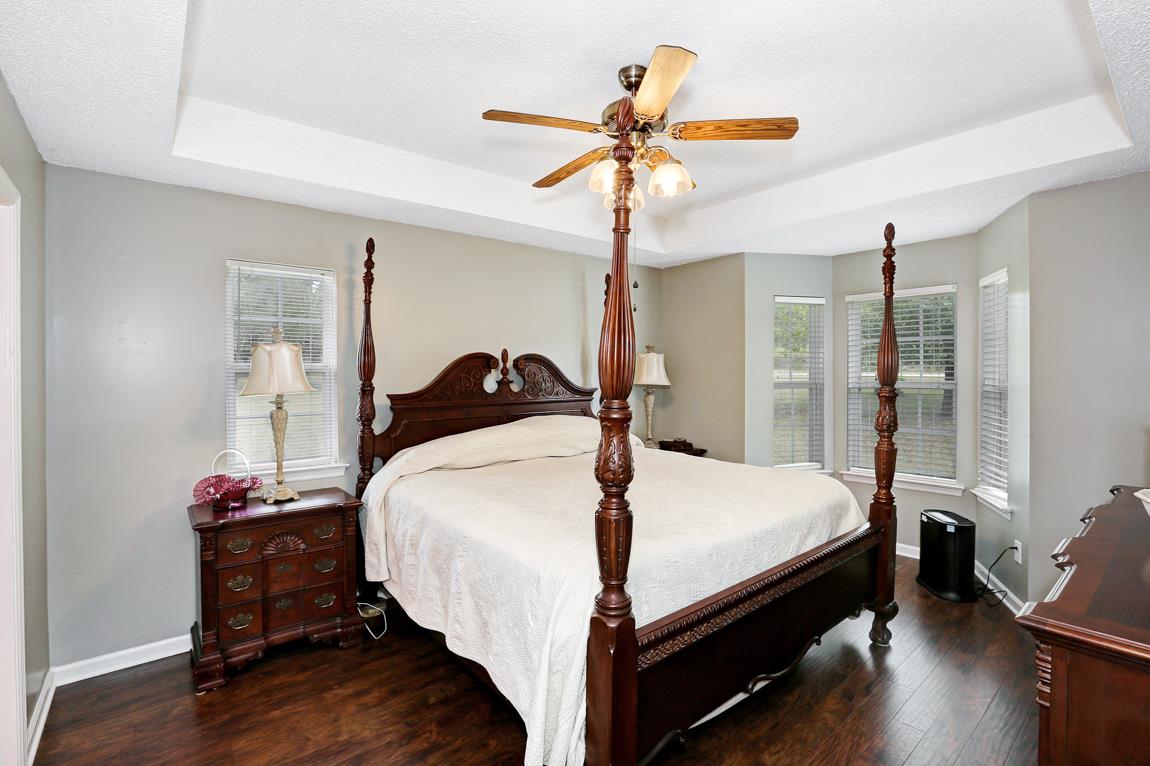 206 Macedonia Road Ardmore, AL 35739 - Photo 11 of 21 Master Bedroom - With bay window, trey ceiling, walk-in closet, laminate flooring and a private bath.