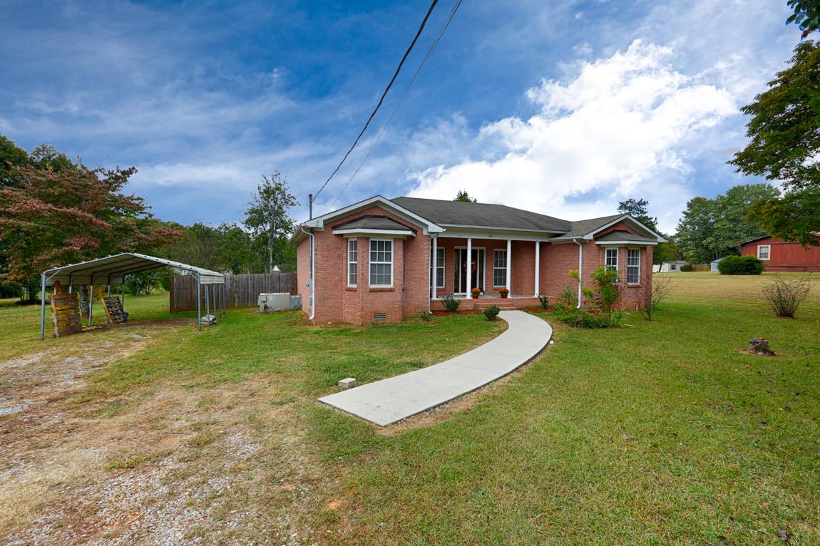 206 Macedonia Road Ardmore, AL 35739 - Photo 2 of 21 Another front view of home showing the carport and a portion of the fenced back yard.