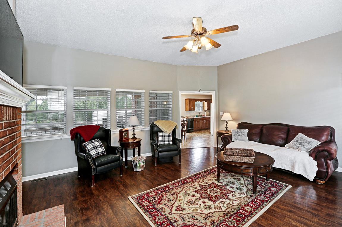206 Macedonia Road Ardmore, AL 35739 - Photo 4 of 21 Living Room with 10' ceiling, gas log fireplace and laminate flooring. And easy access to the eat-in kitchen.