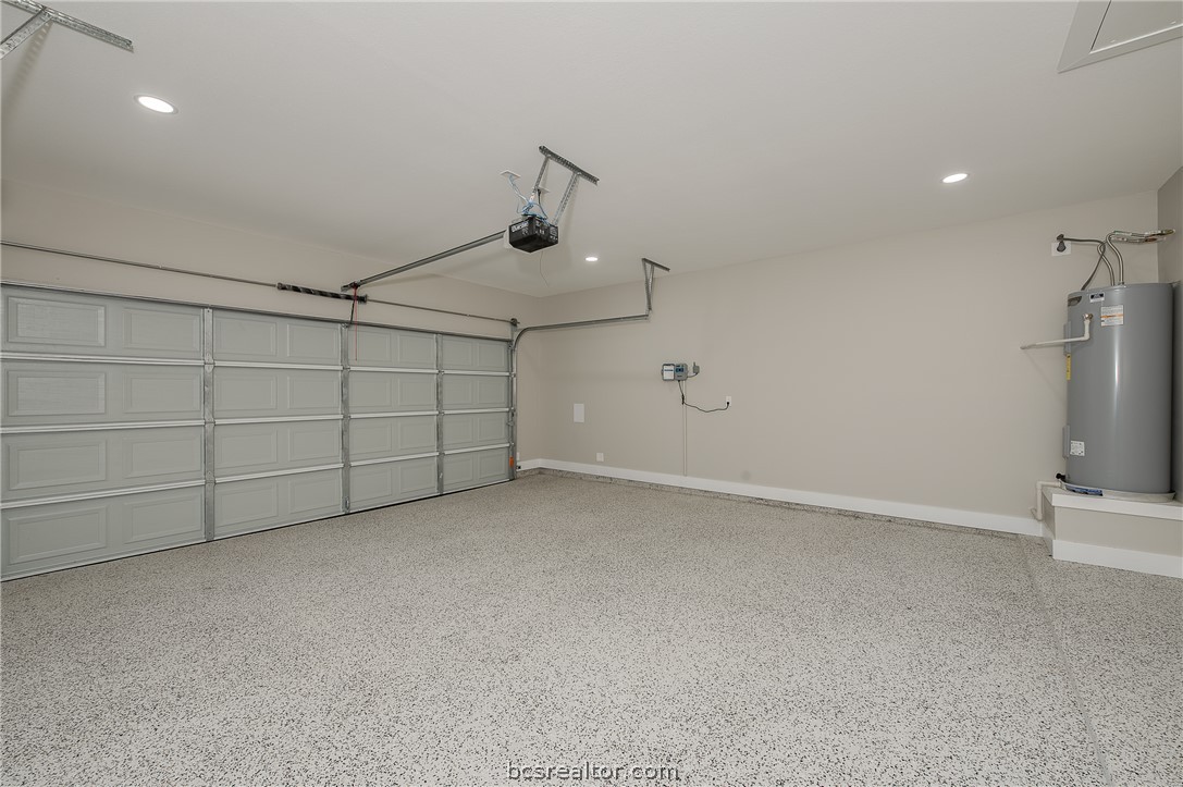 2908 GOLDBERG Drive Bryan, TX 77808 - Photo 3 of 44 Overhead garage door opener plus outside keypad and epoxy paint on the garage floor.
