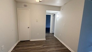 2101 Mustang Road Alvin, TX 77511 - Photo 4 of 9 a view of hallway with wooden floor