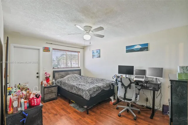 a bedroom with bed and a window