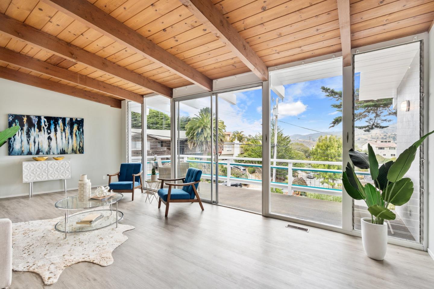 144 Kent Road Pacifica, CA 94044 - Photo 11 of 44 a living room with furniture and a floor to ceiling window