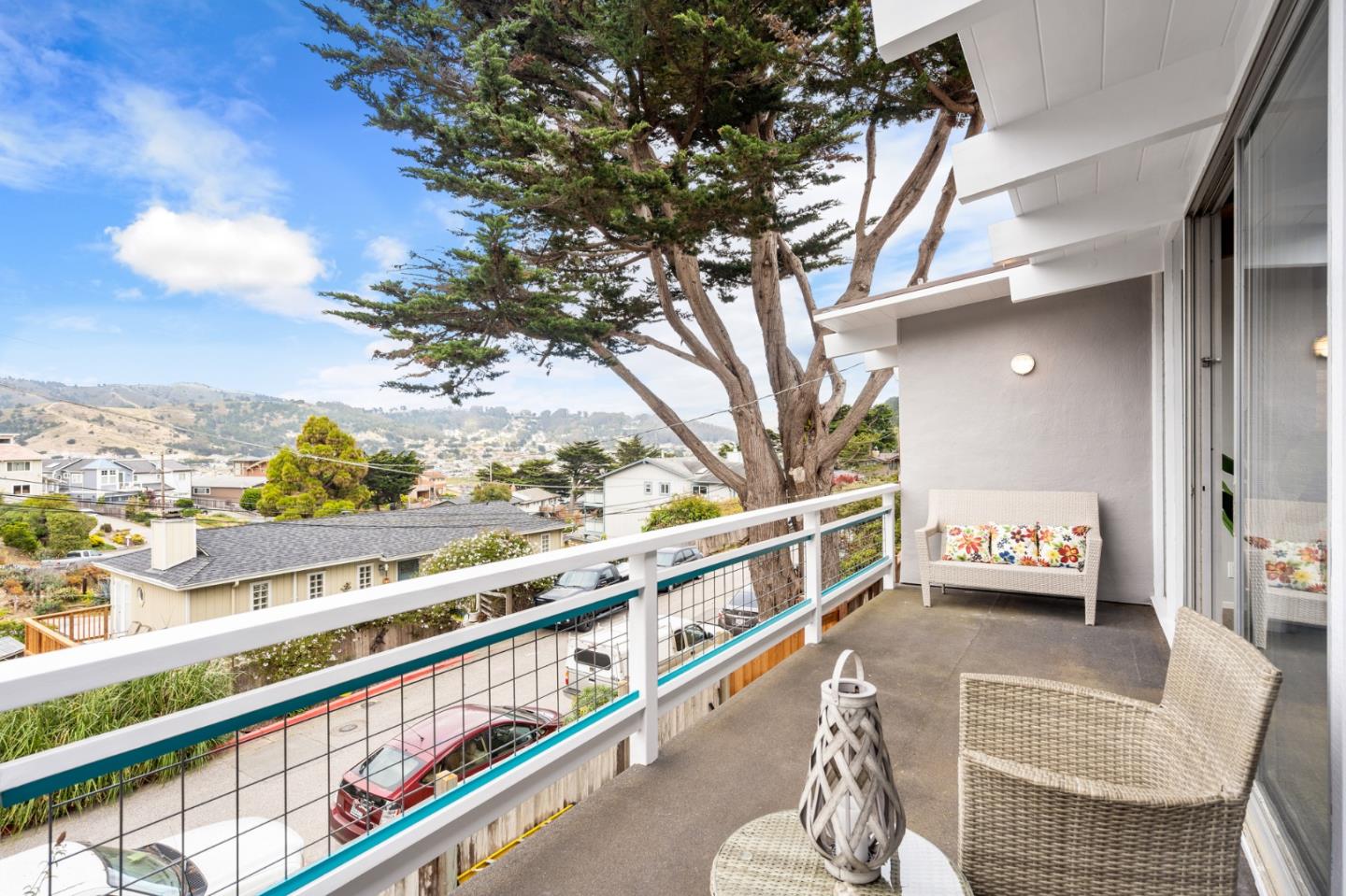 144 Kent Road Pacifica, CA 94044 - Photo 13 of 44 a view of a balcony and car parked