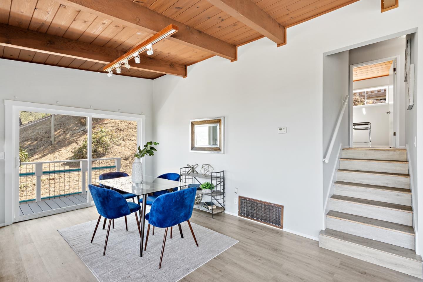 144 Kent Road Pacifica, CA 94044 - Photo 14 of 44 a dining room with furniture and wooden floor