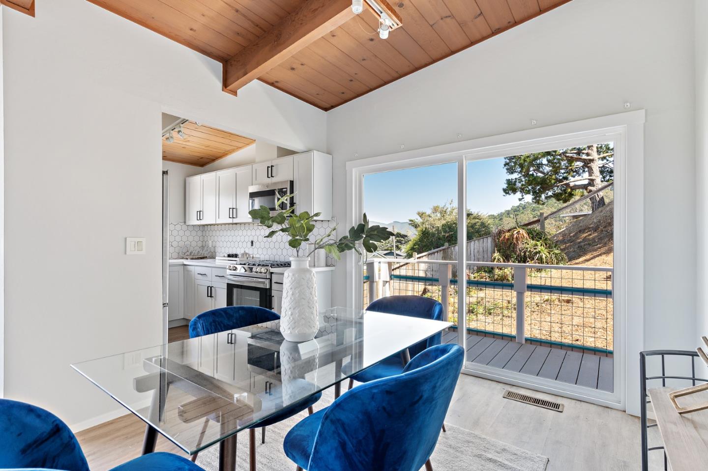 144 Kent Road Pacifica, CA 94044 - Photo 16 of 44 a view of a dining room with furniture window and outside view