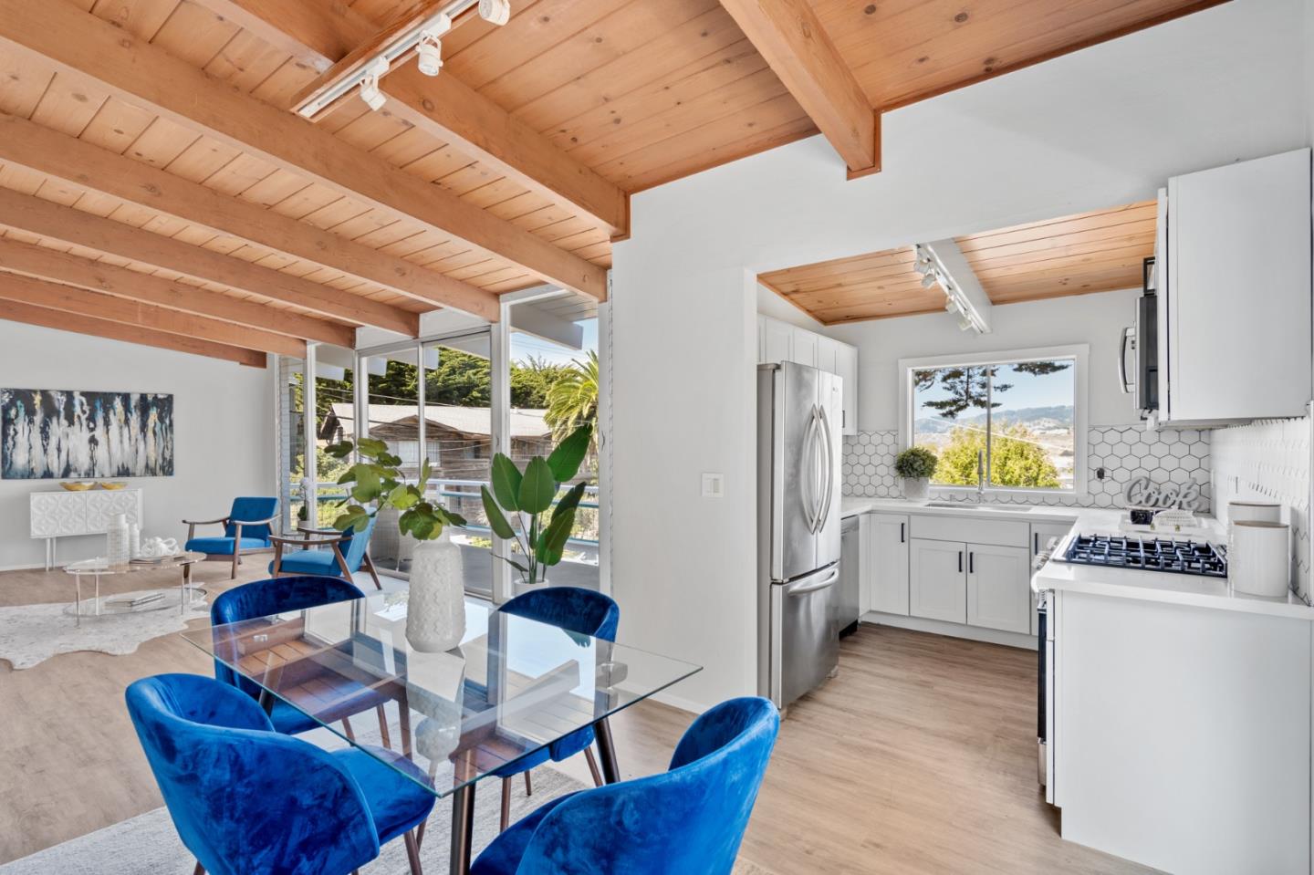 144 Kent Road Pacifica, CA 94044 - Photo 17 of 44 a dining room with furniture and wooden floor