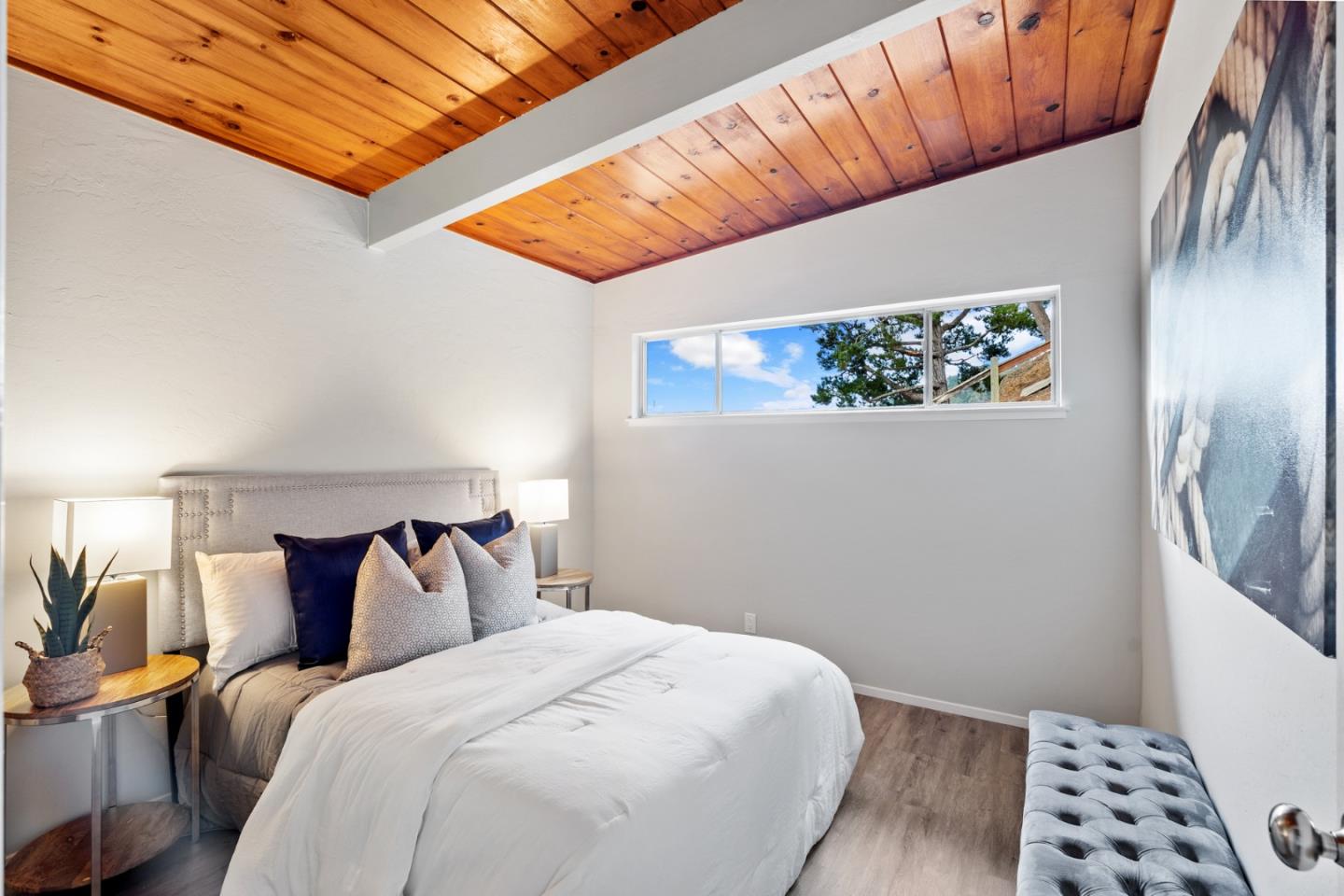 144 Kent Road Pacifica, CA 94044 - Photo 22 of 44 a bedroom with a bed and a window