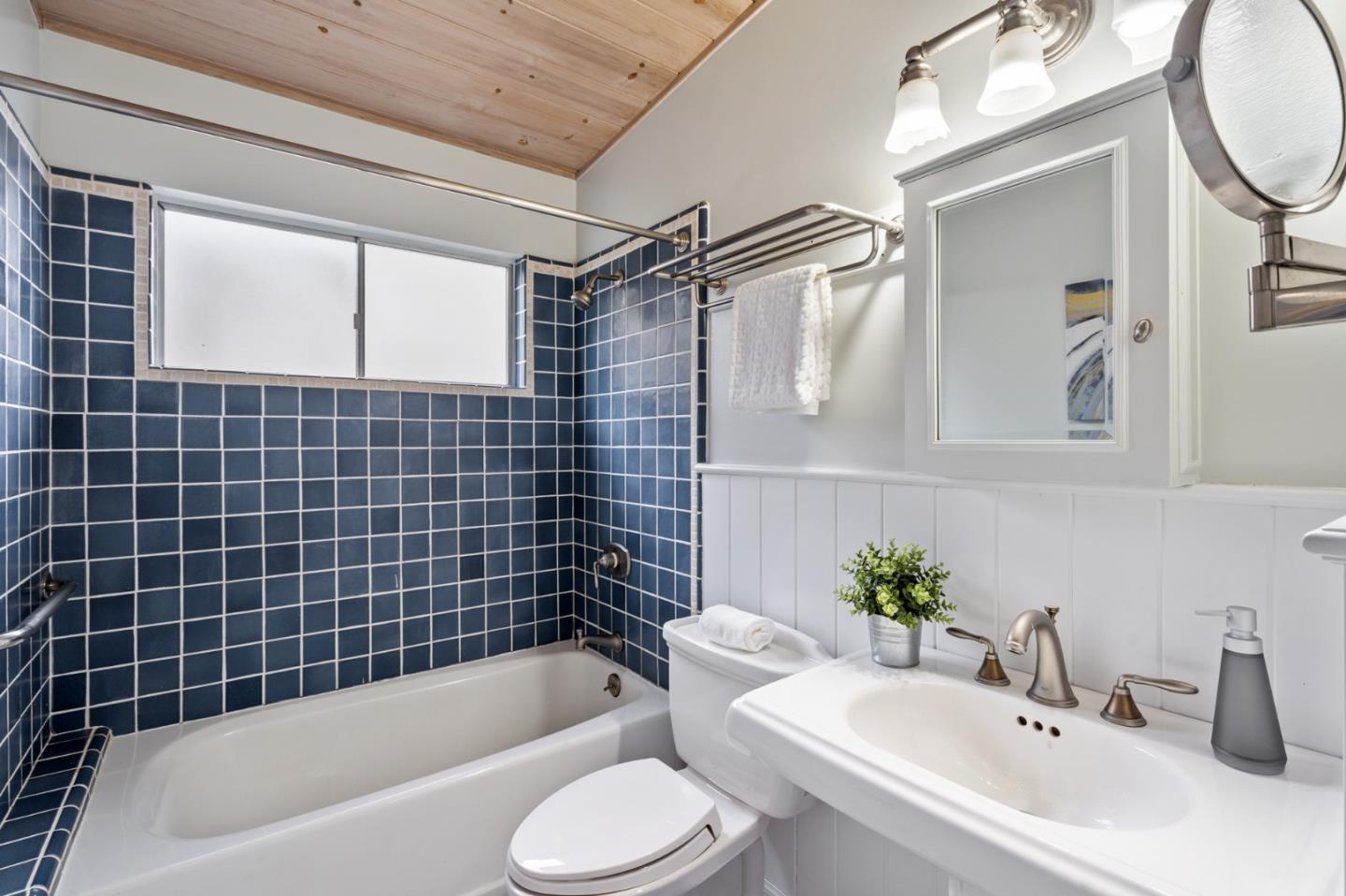 144 Kent Road Pacifica, CA 94044 - Photo 27 of 44 a bathroom with a sink mirror toilet and bathtub