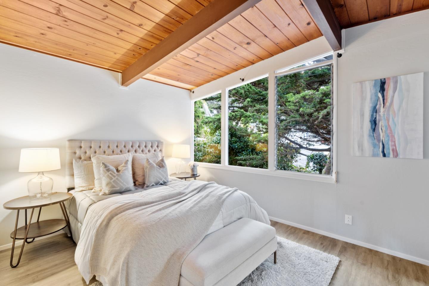 144 Kent Road Pacifica, CA 94044 - Photo 31 of 44 a bedroom with bed and a large window