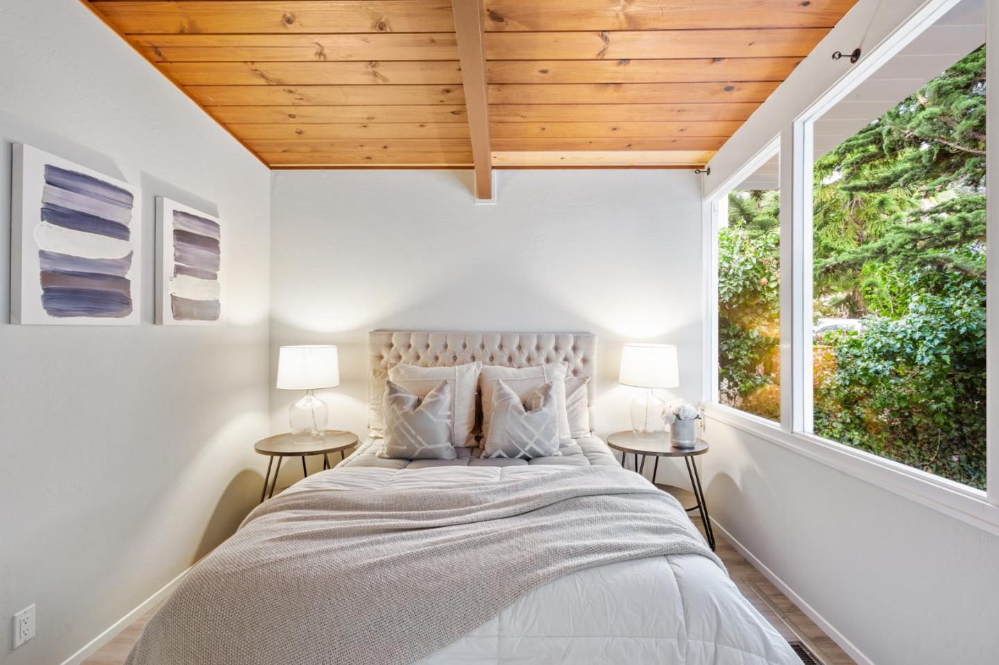 144 Kent Road Pacifica, CA 94044 - Photo 32 of 44 a bedroom with a bed and a window